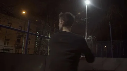 Young guy learns to dance on the street Stock Footage 77380546