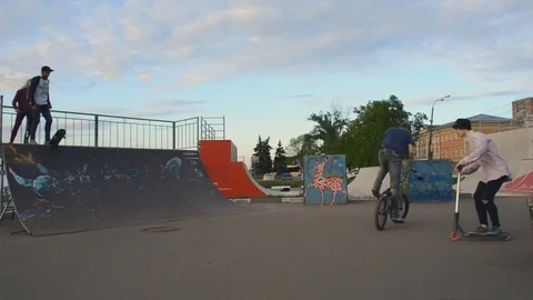 Young guy makes a cool trick on the ramp Stock Footage 76619566