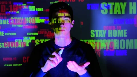 Young guy makes disinfection of hands with sanitizer. Sprinkles antiseptic spray Video stock 130249729