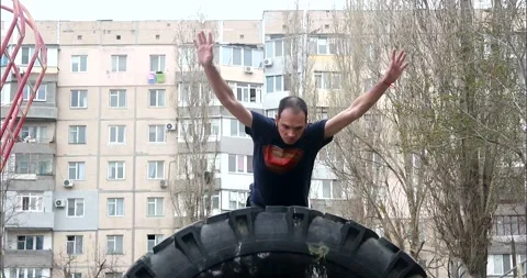 A young guy makes a fly roll in parkour style Stock Footage 265051266