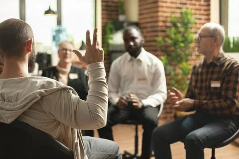 Young guy makes gestures therapy circle Stock Photos