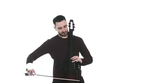 Young guy playing an electric cello. Medium long shot. Isolated Stock Footage 134494906