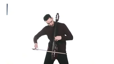 Young guy playing an electric cello. Medium long shot. Isolated Stock Footage 134494969
