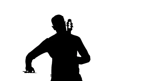 Young guy playing an electric cello. Medium long shot. Silhouette Stock Footage 134522313