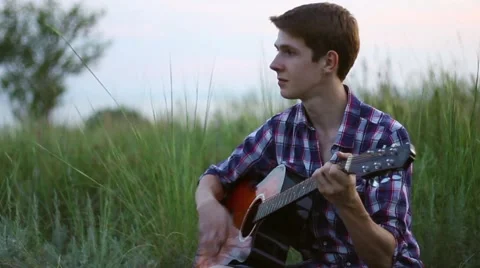 Young Guy Playing Guitar 스톡 동영상 52599882
