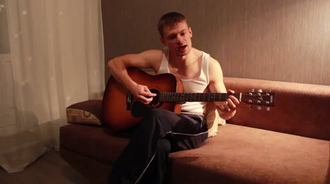 Young Guy Playing Guitar. Full HD 1080 Stock-Footage 42457030