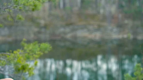 Young guy playing on the harmonica outdoors. Stock Footage 106189774