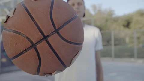 A young guy plays with a ball at dawn. Stock Footage 121094562