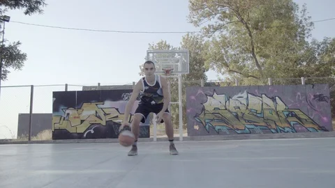 A young guy plays with a ball at dawn. Stock Footage 121198194