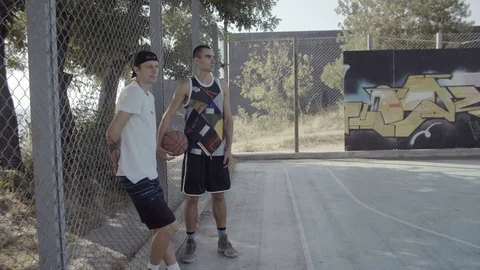 A young guy plays with a ball at dawn. Stock Footage 121362995