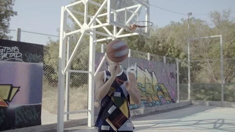 A young guy plays with a ball at dawn. Stock Footage 121363237