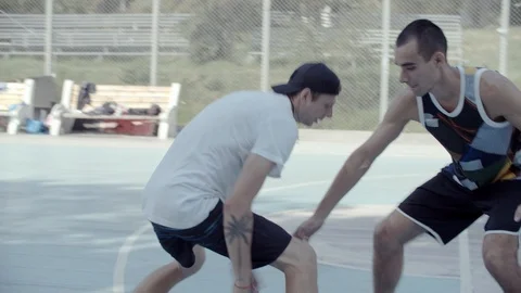 A young guy plays with a ball at dawn. Stock Footage 121363356