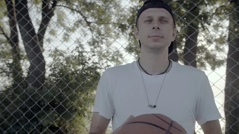 A young guy plays with a ball at dawn. Stock Footage 125096915