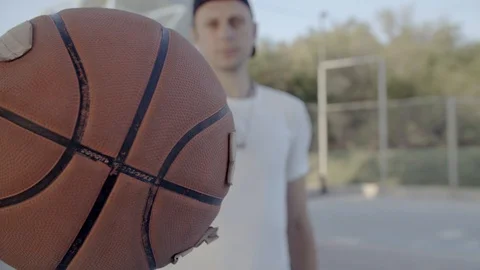 A young guy plays with a ball at dawn. Stock Footage 125097357