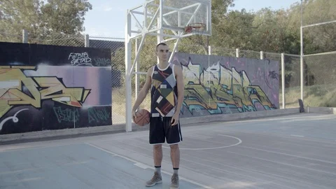 A young guy plays with a ball at dawn. Stock Footage 125132800