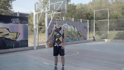 A young guy plays with a ball at dawn. Stock Footage 125133042