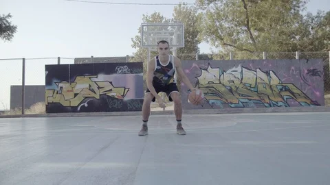 A young guy plays with a ball at dawn. Stock Footage 125180823