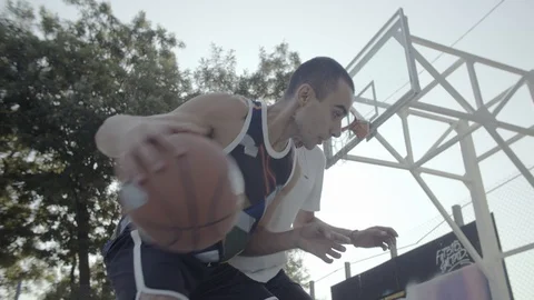 A young guy plays with a ball at dawn. Stock Footage 125181131