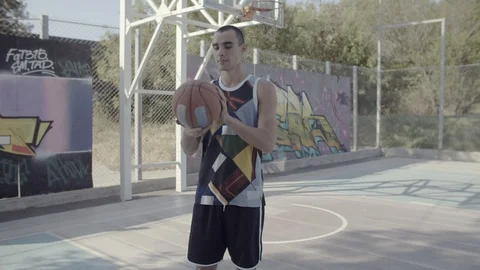 A young guy plays with a ball at dawn. Stock Footage 125267987