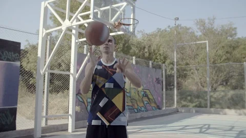 A young guy plays with a ball at dawn. Stock Footage 125269198