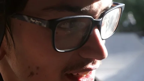 Young guy points to the side and says something to the operator Stock Footage 103649800