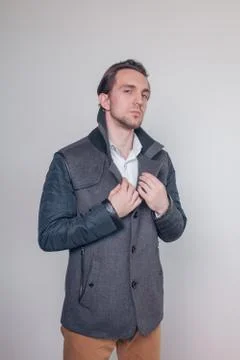 Young guy posing in autumn spring coat. Style. Beauty. Fashion. Stock Photos