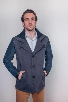Young guy posing in autumn spring coat. Style. Beauty. Fashion. Stock Photos