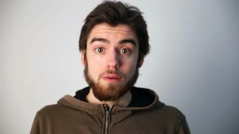 Young guy posing in front of camera. shock and surprise. Stock Footage 85956978