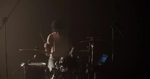 Young guy practicing beats on drums during rehearsal Stock Footage 249851900