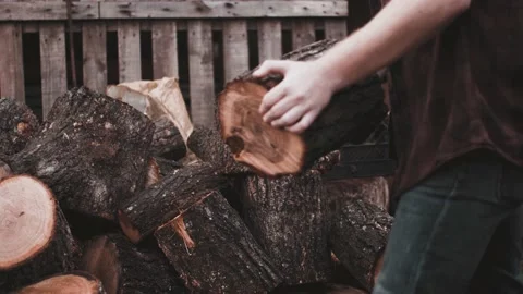 Young guy preparing to chop wood Stock Footage 142108765