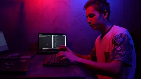 Young guy, programmer working at computer Stock Footage 124360778