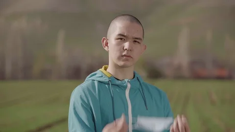 Young guy puts on a mask from the virus Stock Footage 126952046