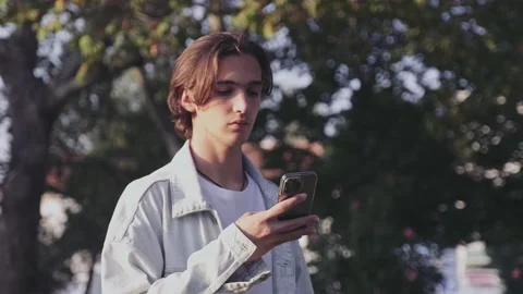 Young  guy received an sms with bad news. Sad man with a mobile phone Stock Footage 201547411