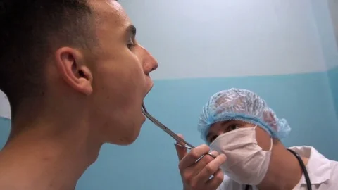 The young guy on reception at the dentist. Dental treatment 스톡 동영상 77197266
