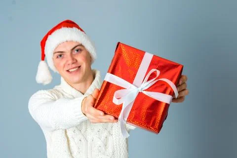 Young guy with red gift in hands Stock Photos