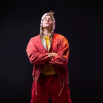 A young guy in a red youth jacket with a hood. Stylish outfit, Foto stock