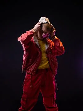 A young guy in a red youth jacket with a hood. Stylish outfit, Foto stock