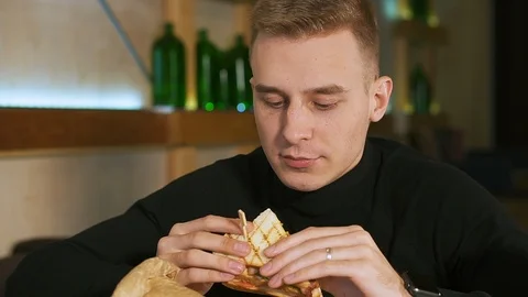 Young guy in a restaurant. 스톡 동영상 114151357