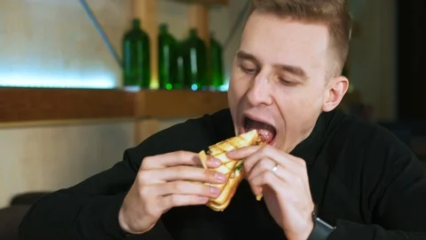 Young guy in a restaurant. Video stock 114153162