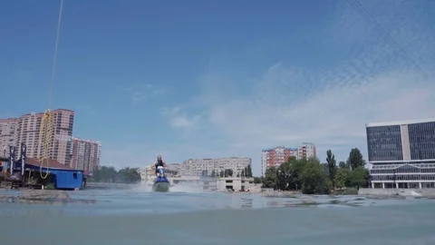 A young guy is riding a hydrocycle on the lake 動画素材 92783751