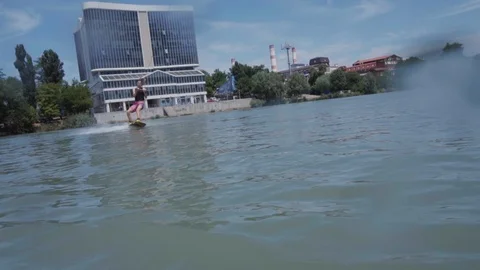 A young guy is riding a hydrocycle on the lake Stock Footage 92785282