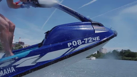 A young guy is riding a hydrocycle on the lake Stock Footage 92785372