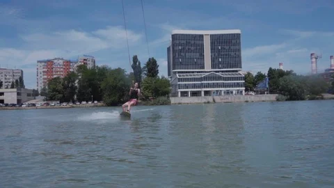 A young guy is riding a hydrocycle on the lake Stock Footage 92785477
