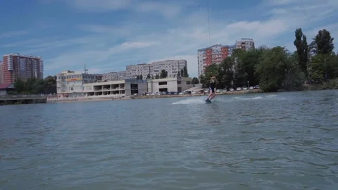 A young guy is riding a hydrocycle on the lake Stock Footage 92786016