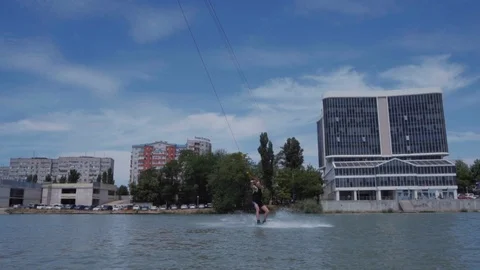 A young guy is riding a hydrocycle on the lake Stock Footage 92786133