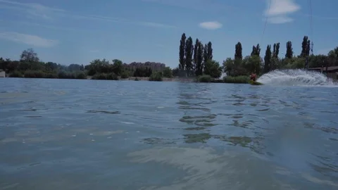 A young guy is riding a hydrocycle on the lake Stock Footage 92786281