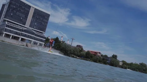 A young guy is riding a hydrocycle on the lake Stock Footage 92786320