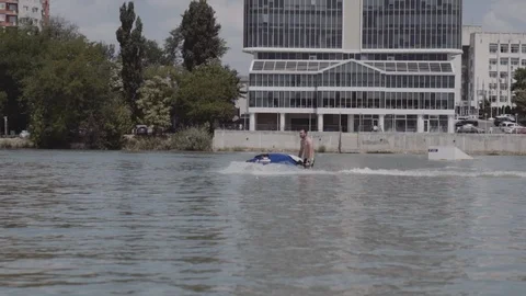 A young guy is riding a hydrocycle on the river Stock Footage 90634678