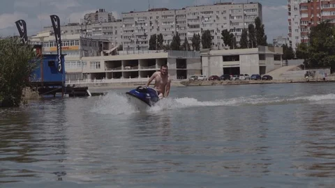 A young guy is riding a hydrocycle on the river Stock Footage 90634751