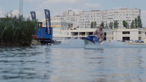 A young guy is riding a hydrocycle on the river Stock Footage 90634828